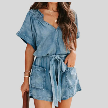 Uformell romper i denim med smockdetaljer