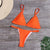 oransje bikini med ringdetaljer