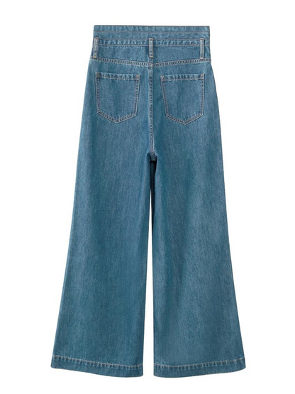 The back side of a pair of high waisted, wide leg, denim jeans against a plain white background.